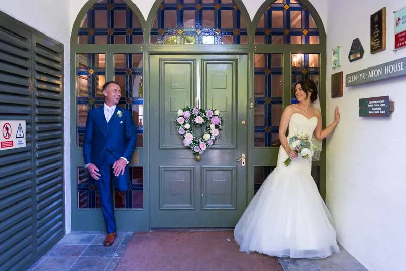 Glen Yr Afon wedding bride & groom by door