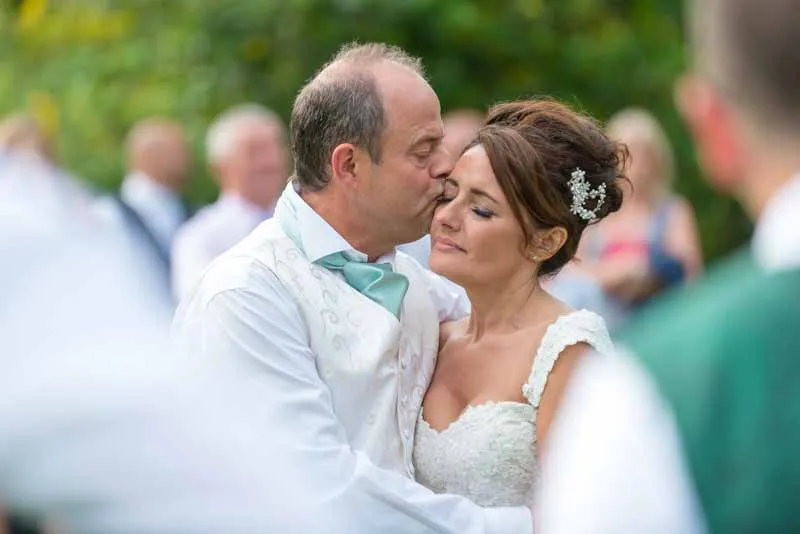 Glen Yr Afon wedding groom kissing bride