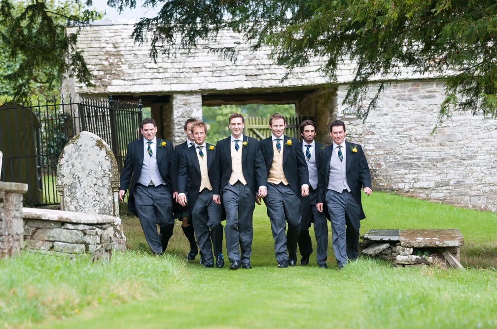 Llangoed hall wedding groom walking to St Stephen's Church