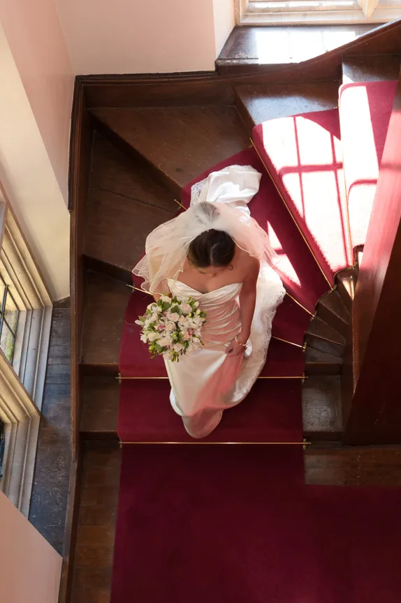 Llangoed hall wedding bride walking down stairs