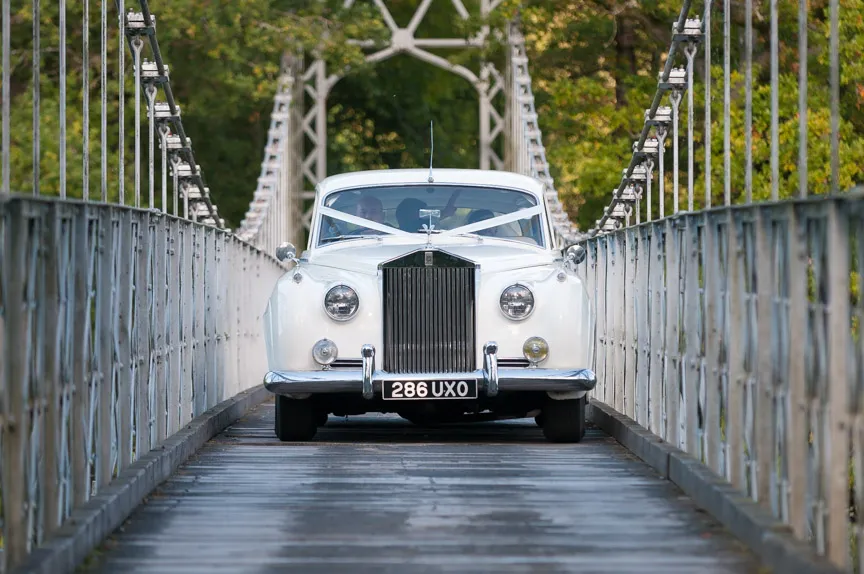 Llangoed hall wedding Rolls Royce on Lady Milford's Bridge