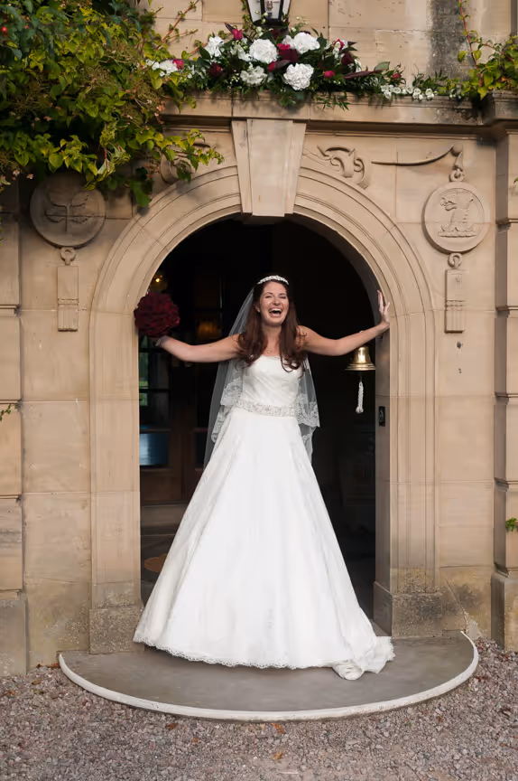 Llangoed hall wedding bride in doorway