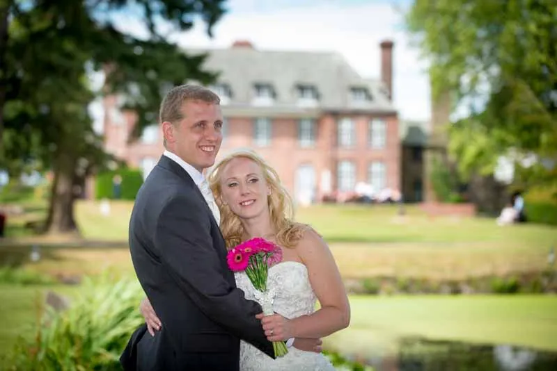 Bride and groom in the gardens of Sant Ffraed House, Abergavenny
