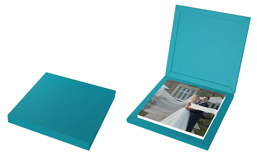 Two blue boxes, one closed and one open showing a photo of a bride and groom embracing outdoors.