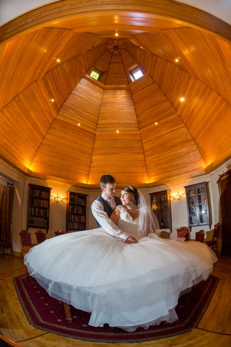 Glen Yr Afon wedding bride & groom in library