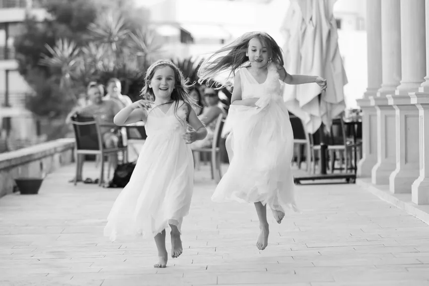 young bridesmaids skipping at luxury wedding at Hospes Maricel Majorca