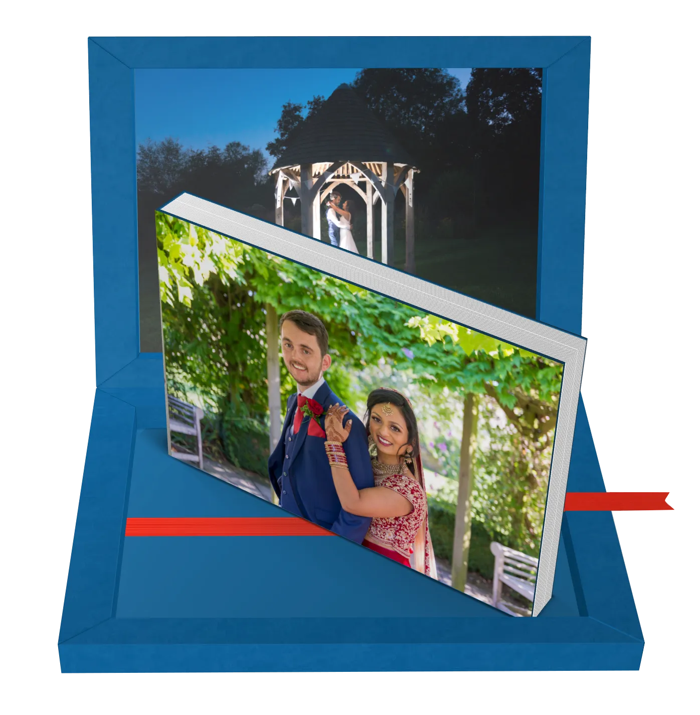 Blue gift box containing a wedding photo album with a couple in traditional attire on the cover, and a night scene of a bride and groom embracing in a gazebo as the inner box lid image.