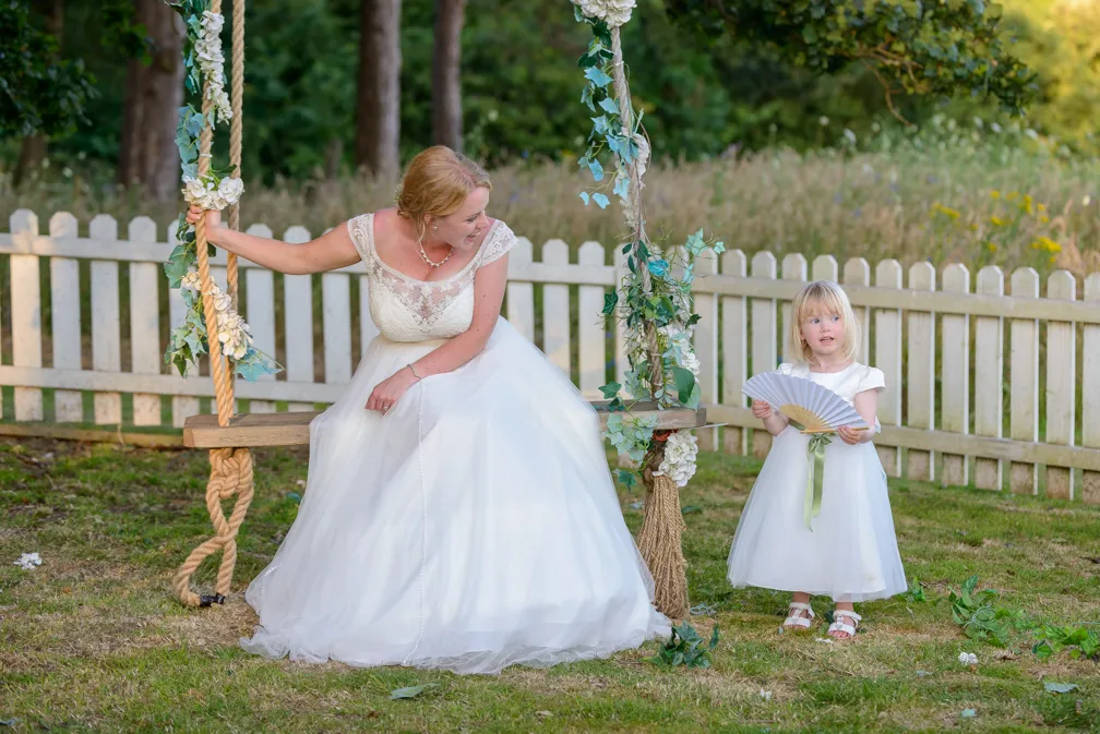 St Tewdrics House wedding bride on swing with flower girl