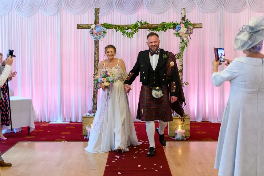Glen Yr Afon wedding bride & groom walking down aisle