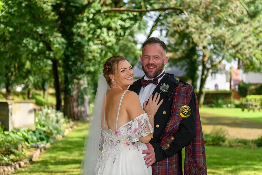 Glen Yr Afon wedding couple on lawn