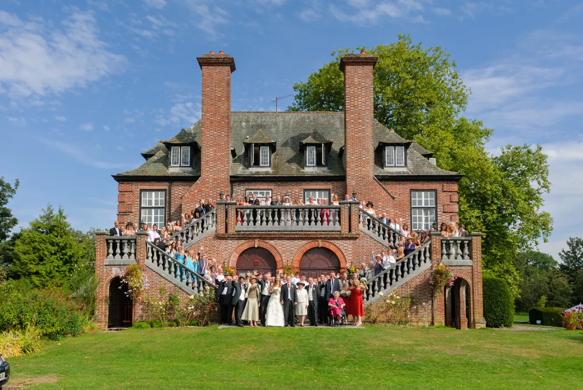 Wedding group shot on side of Sant Ffraed House