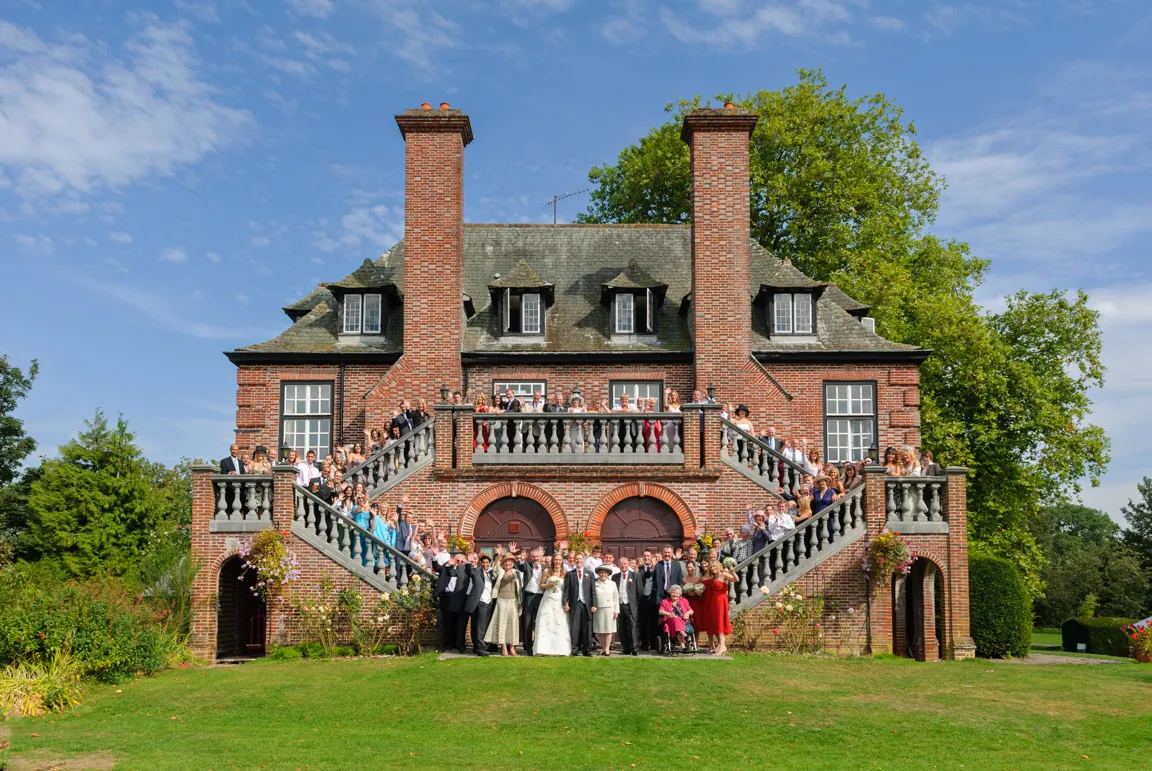 Wedding group shot on side of Sant Ffraed House