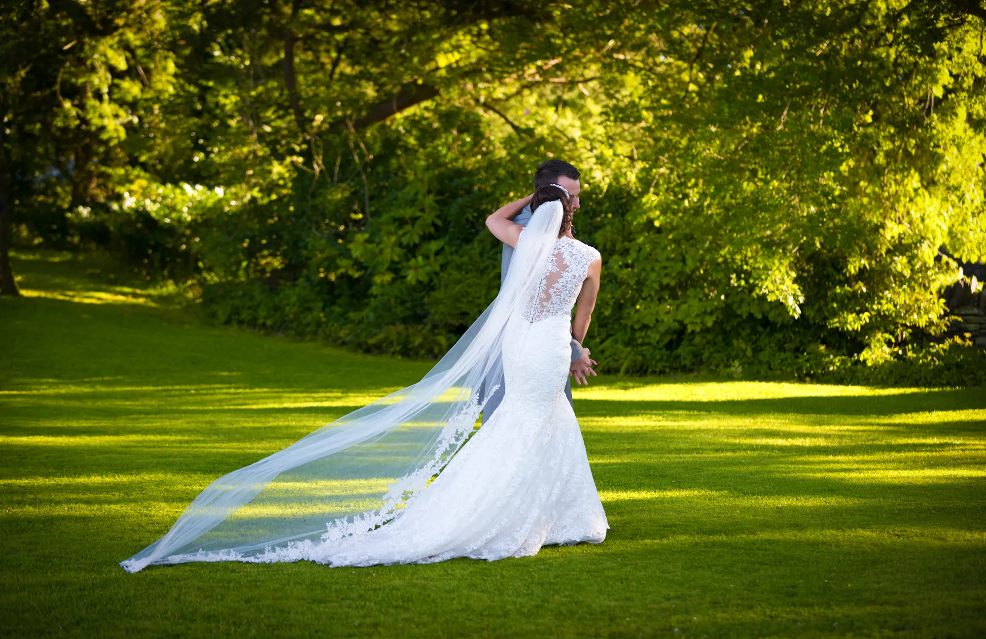 Bride & Groom at wedding walking in gardens at Llechwen Hall