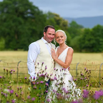 Martin & Beth in wild flowers at Llangoed Hall by Andrew Hazard Photography