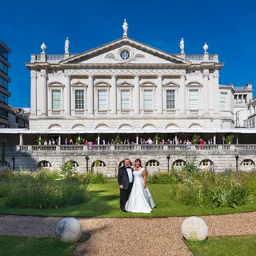 Couple in yellow rape fields at wedding at Mounton Brook Lodge by Andrew Hazard Photography
