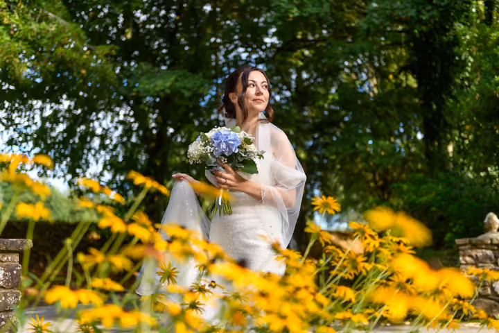 Glen Yr Afon wedding bride & groom kissing in garden