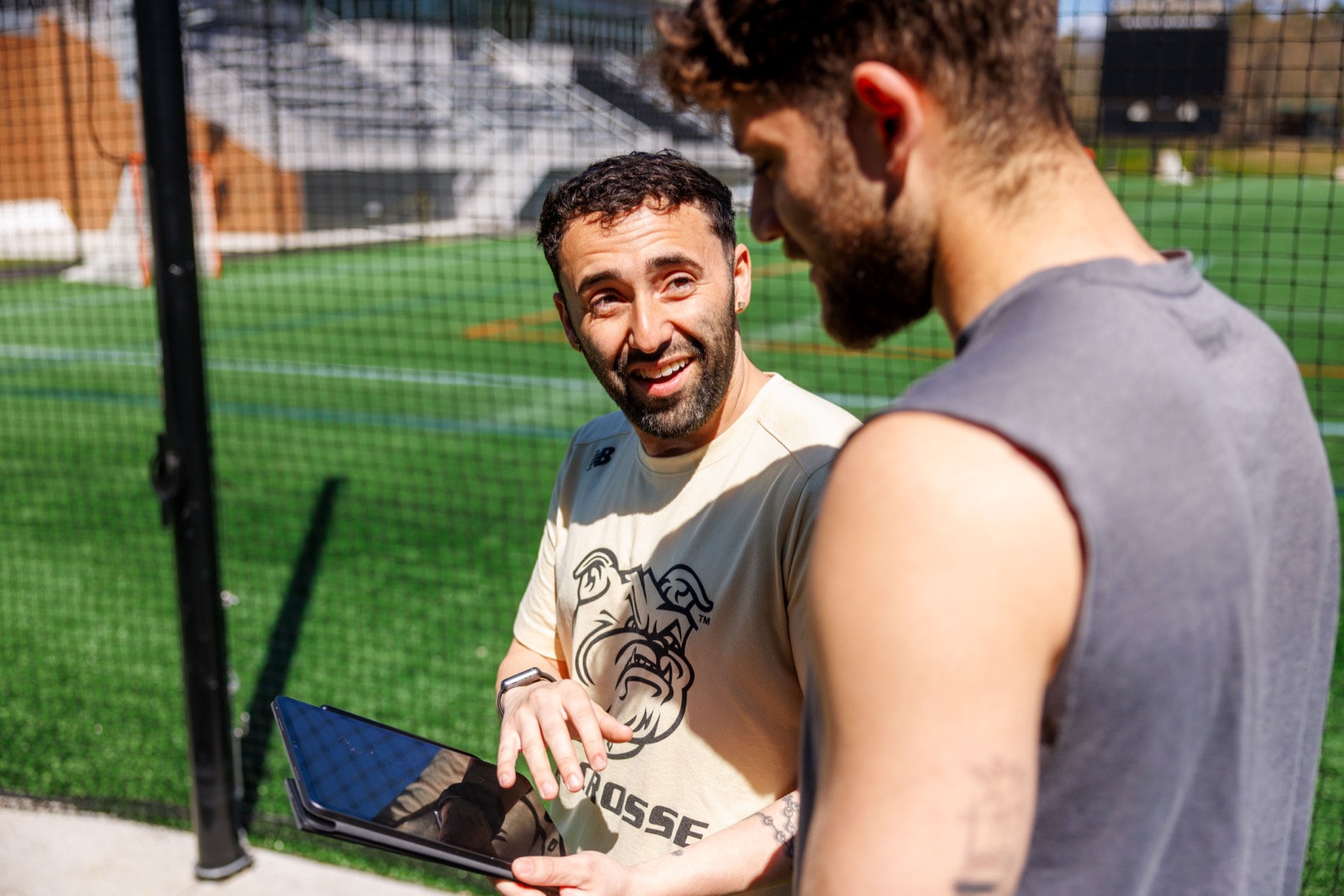 Bryant University lacrosse players wearing PlayerData vests