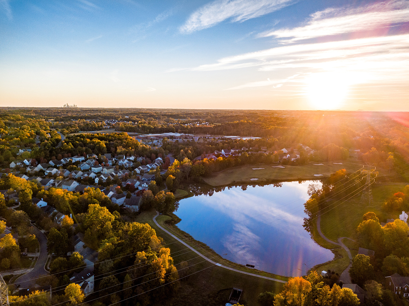 Aerial view of homes and lake in Charlotte area