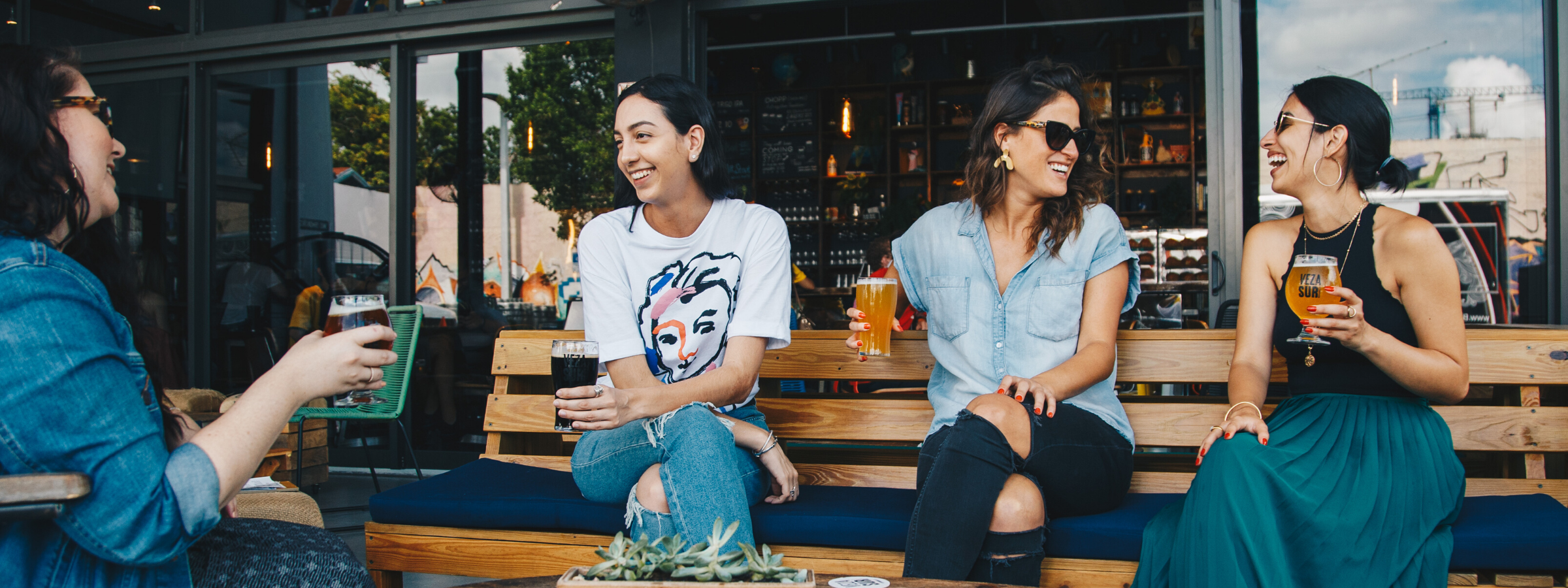 Girlfriends talking and enjoying coffee