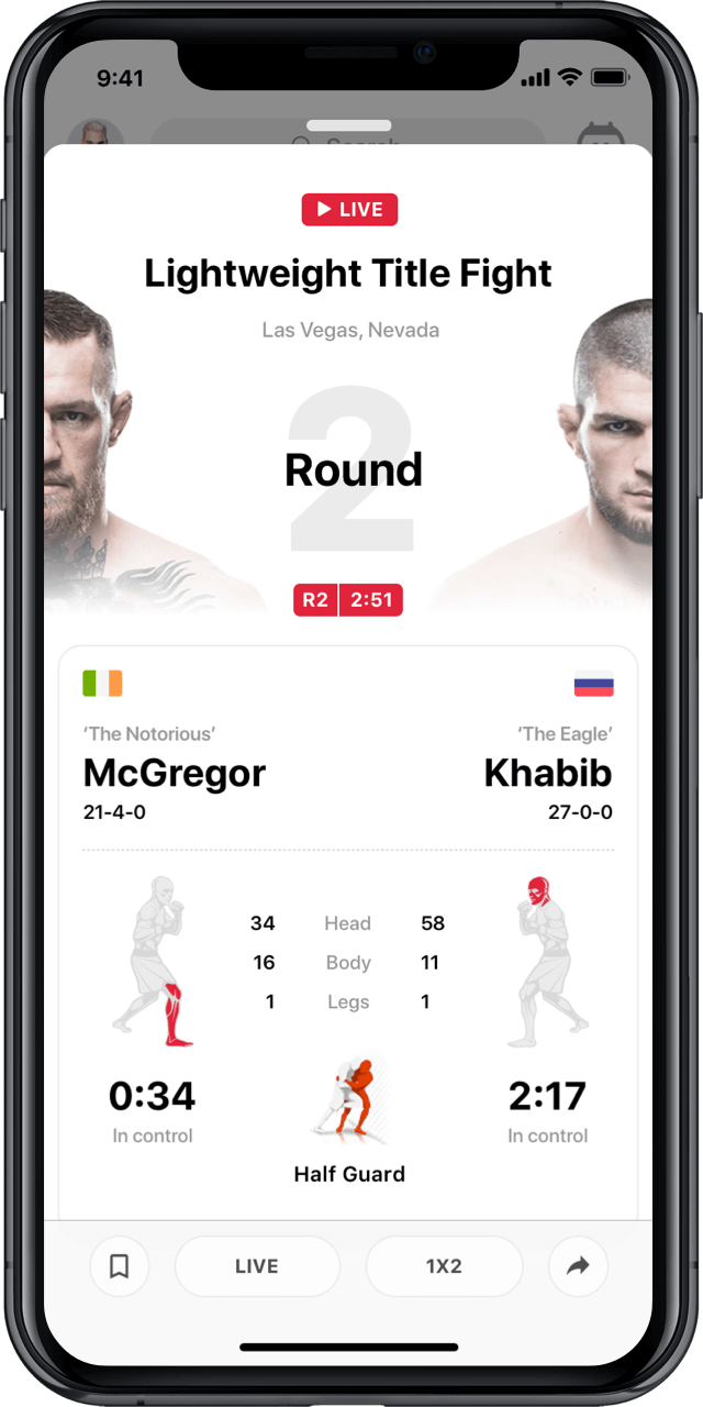 Iphone with live UFC match statistics modal