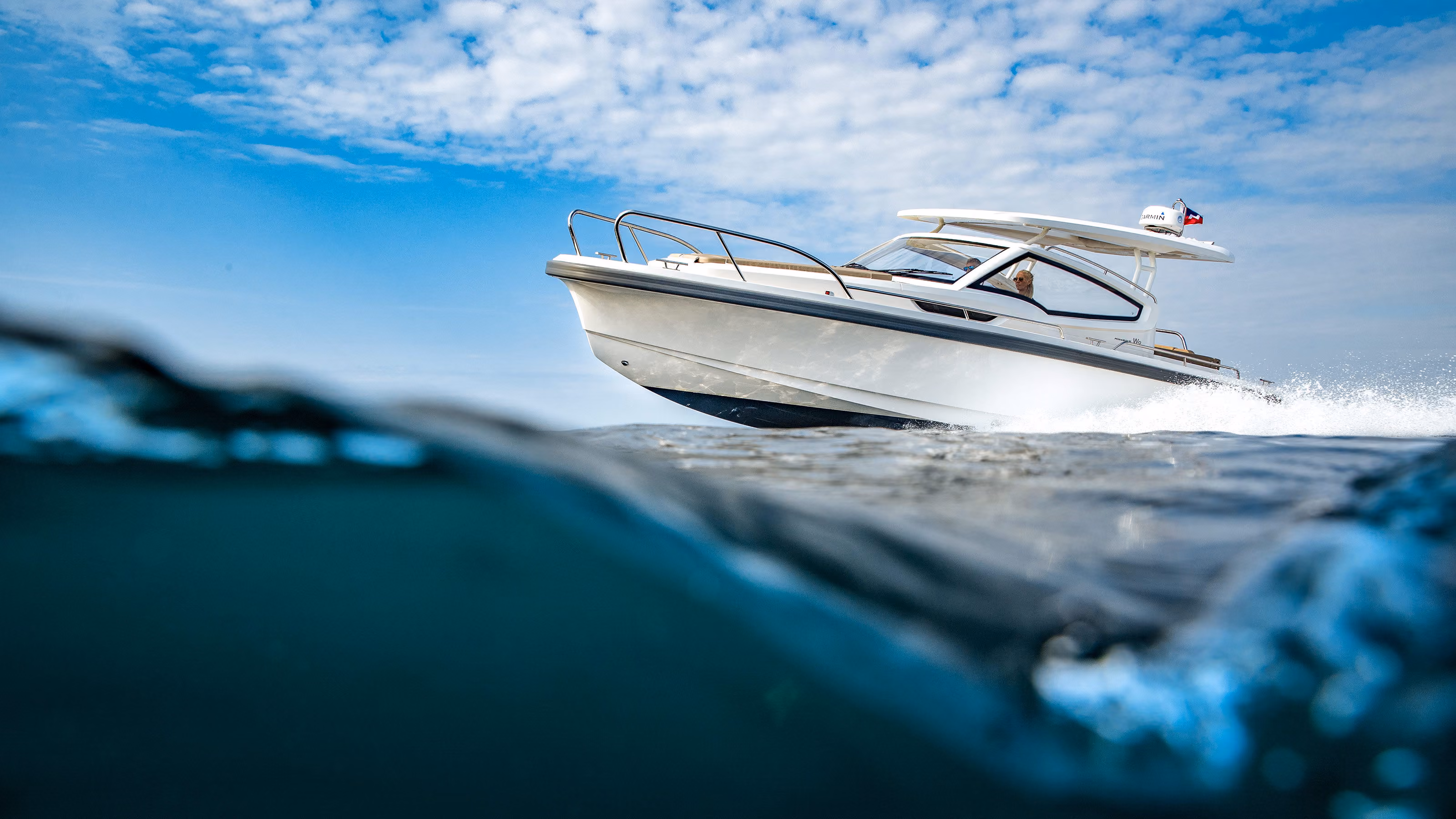 Nimbus boat cruising the waters seen from inside the water