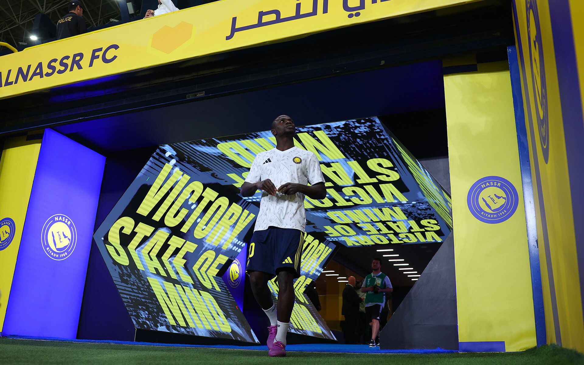 Al Nassr — player running out through the Victory State of Mind entrance