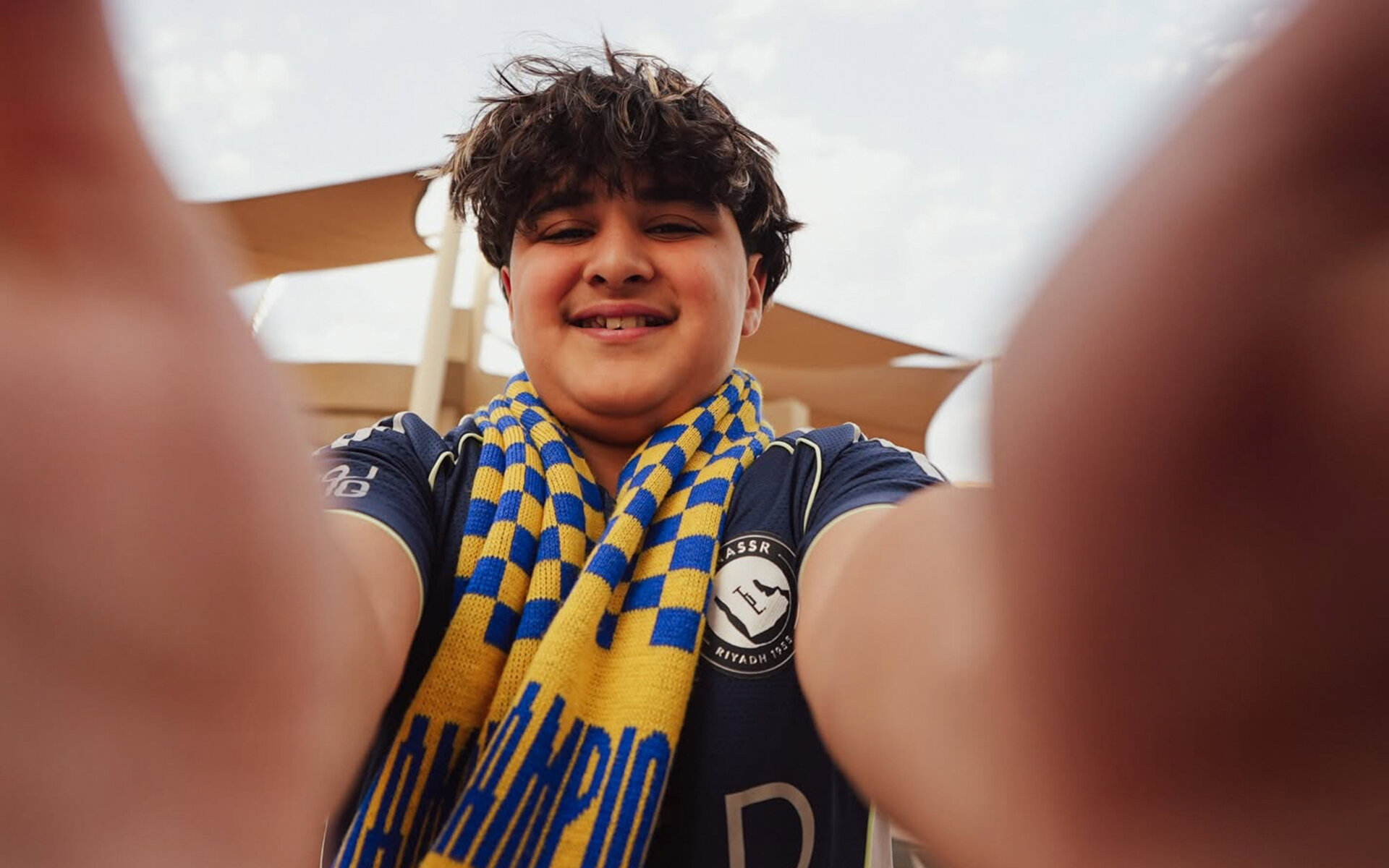 Al Nassr — young fan in a club scarf