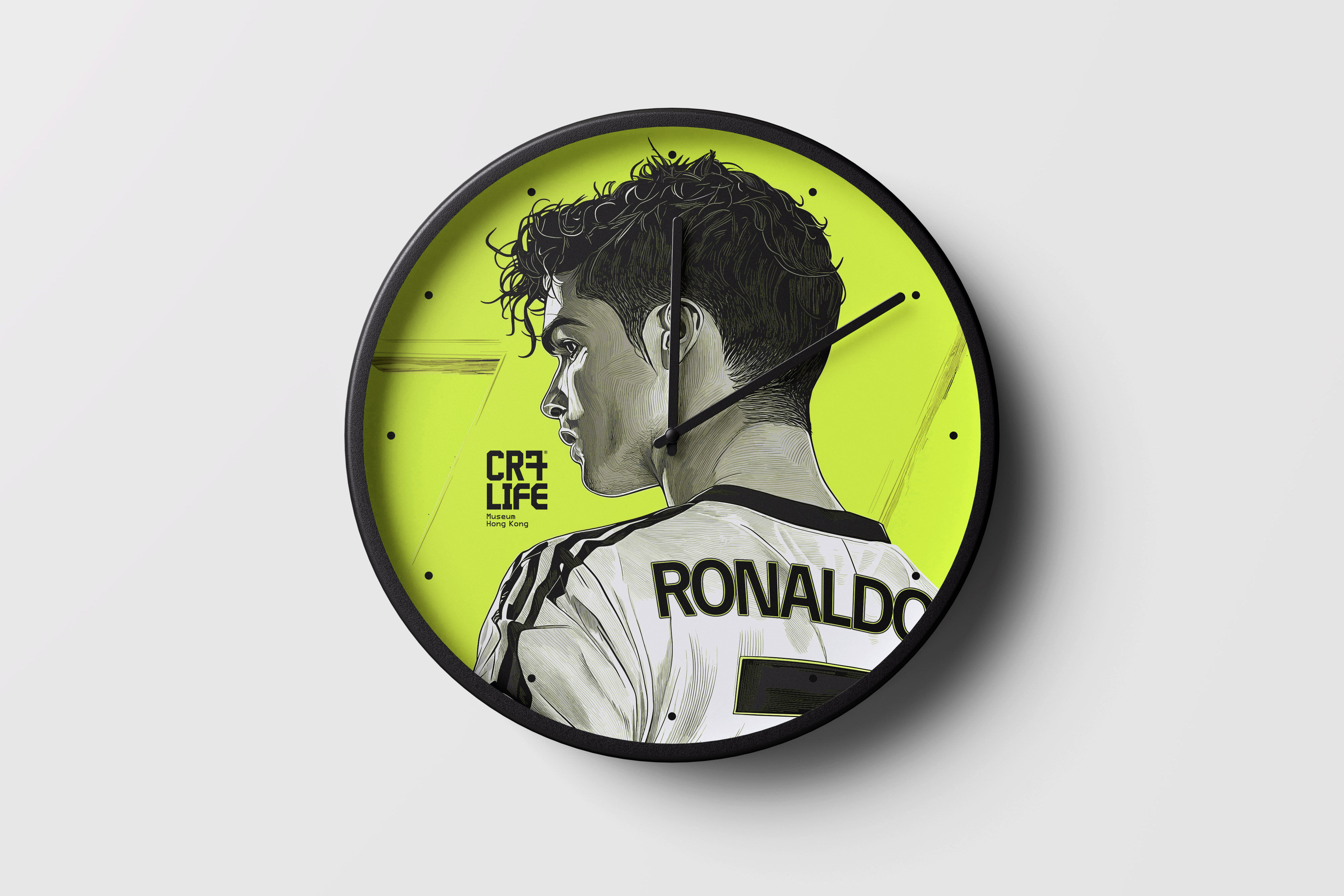 CR7 Life Museum merchandise — lime wall clock with an illustrated Ronaldo shirt back