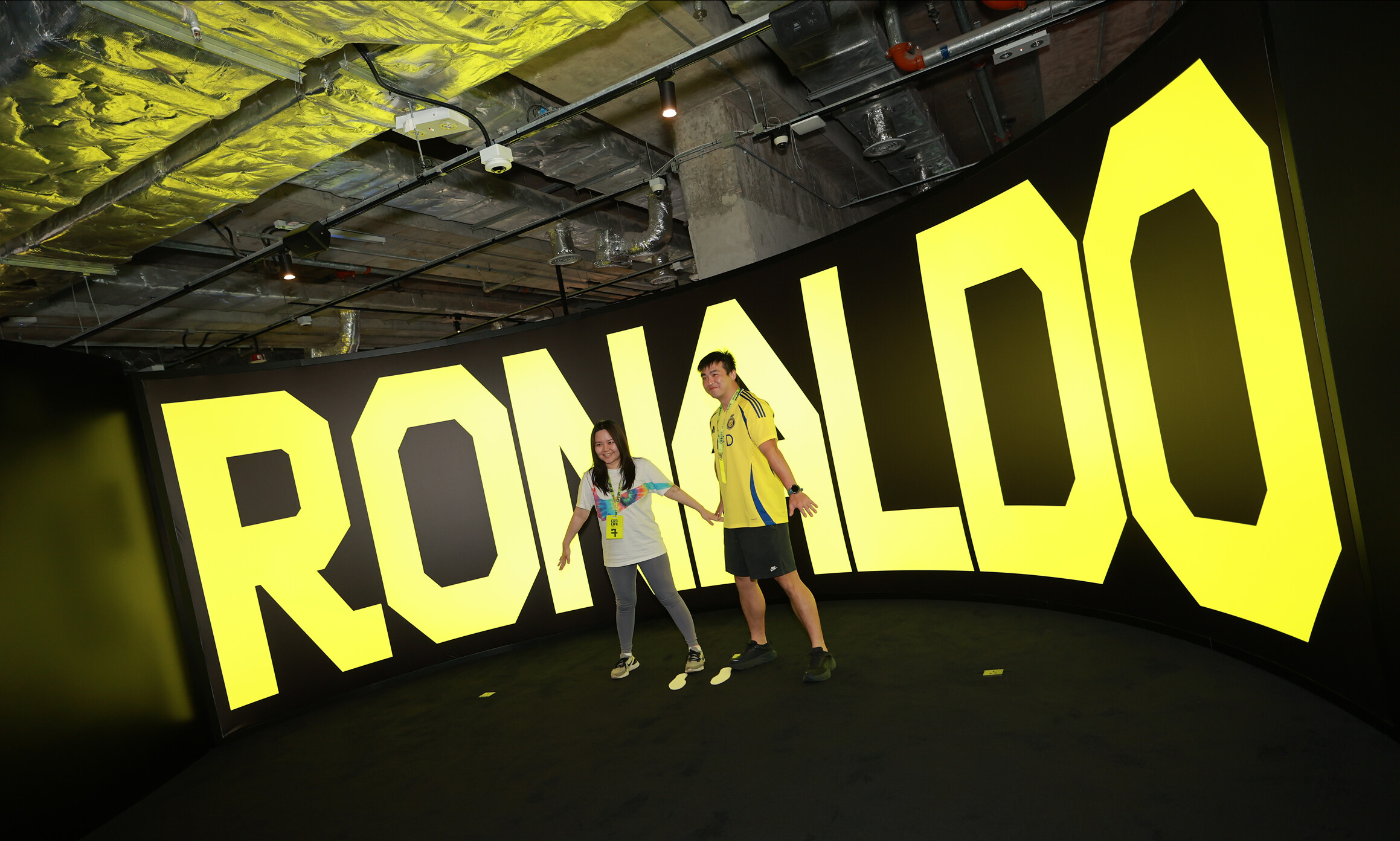 CR7 Life Museum — visitors in front of the giant illuminated RONALDO letters