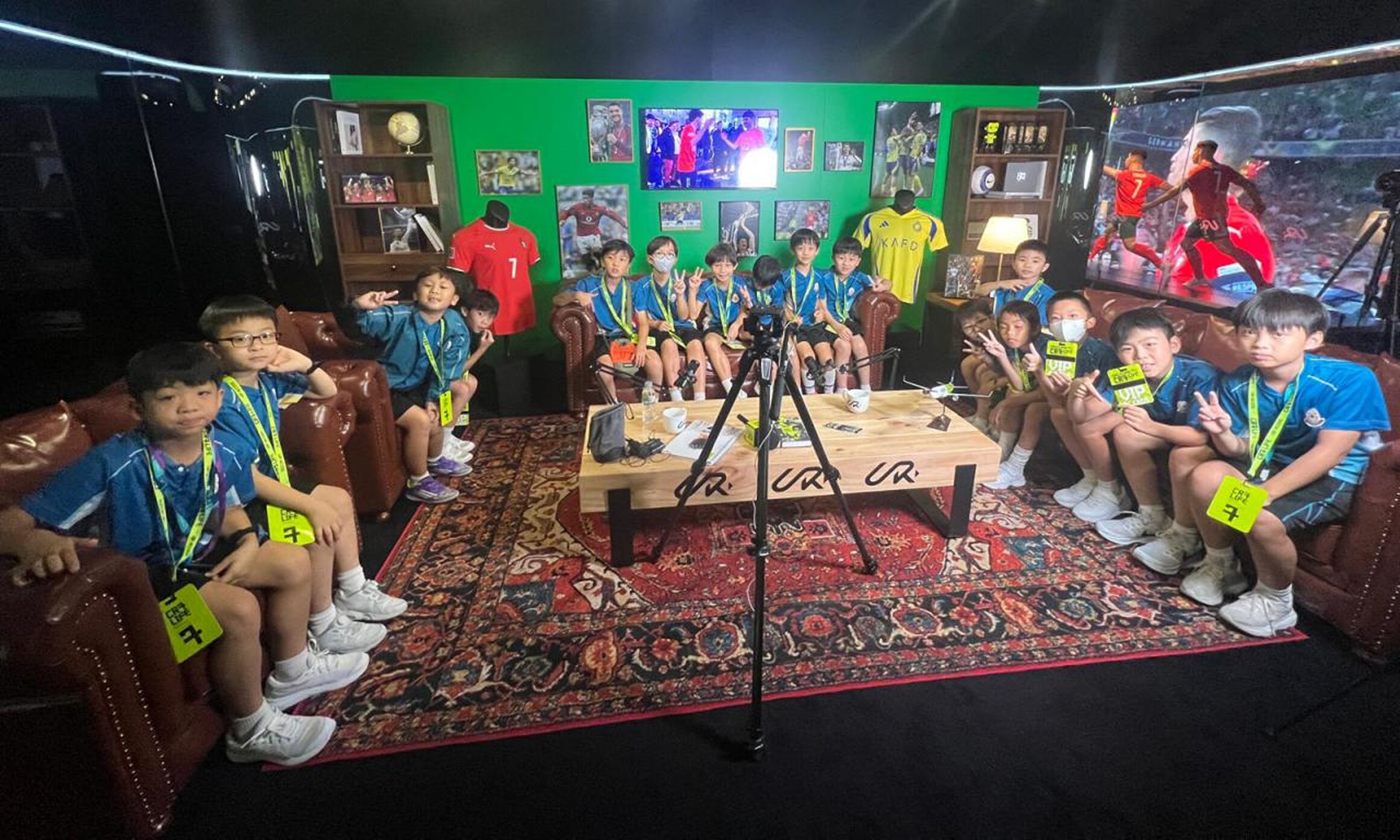 CR7 Life Museum — school group seated in the recreated living-room set