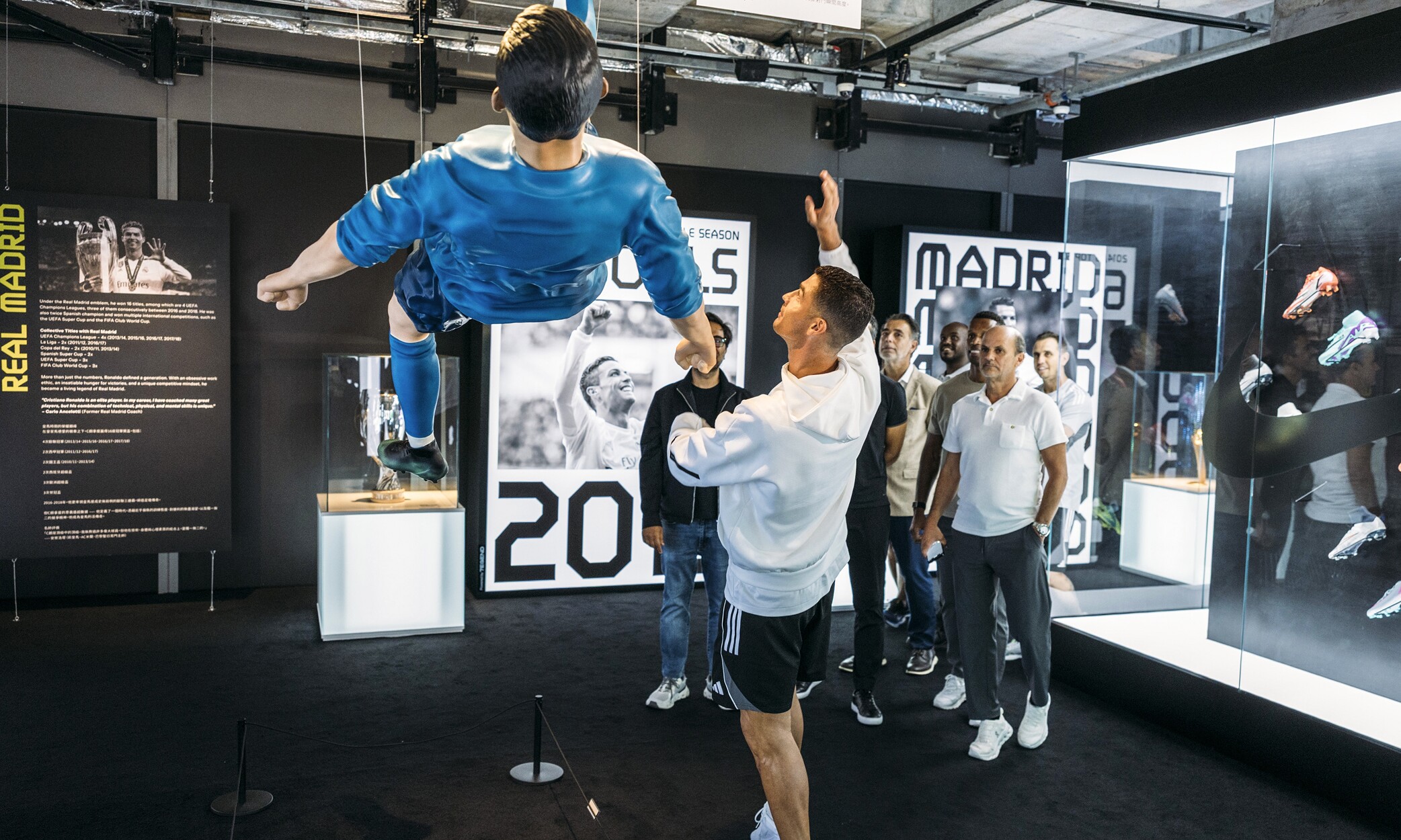 CR7 Life Museum — visitors beneath a suspended Ronaldo figure in the Real Madrid gallery