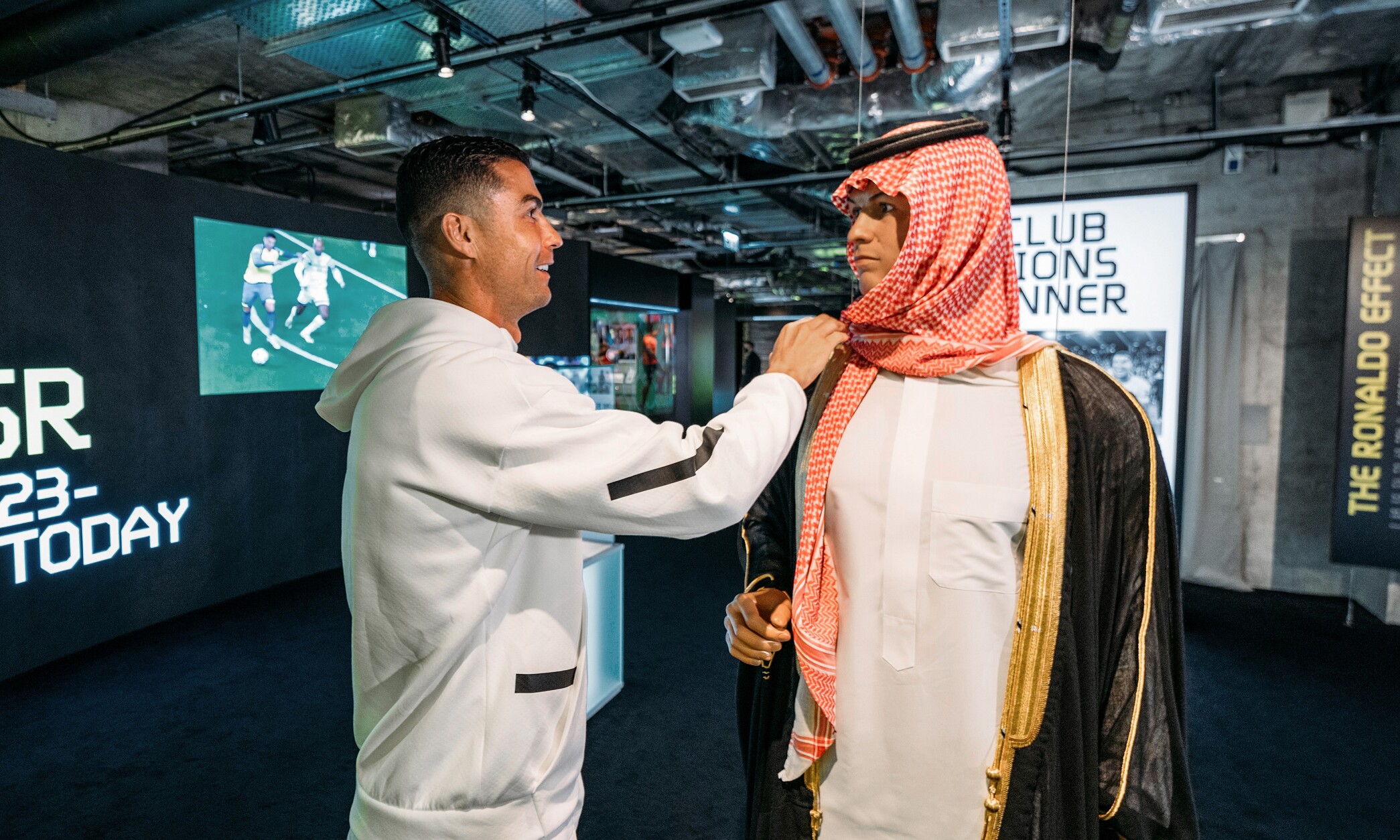 CR7 Life Museum — recreated Al Nassr welcome scene with a Ronaldo figure greeting a figure in Saudi dress