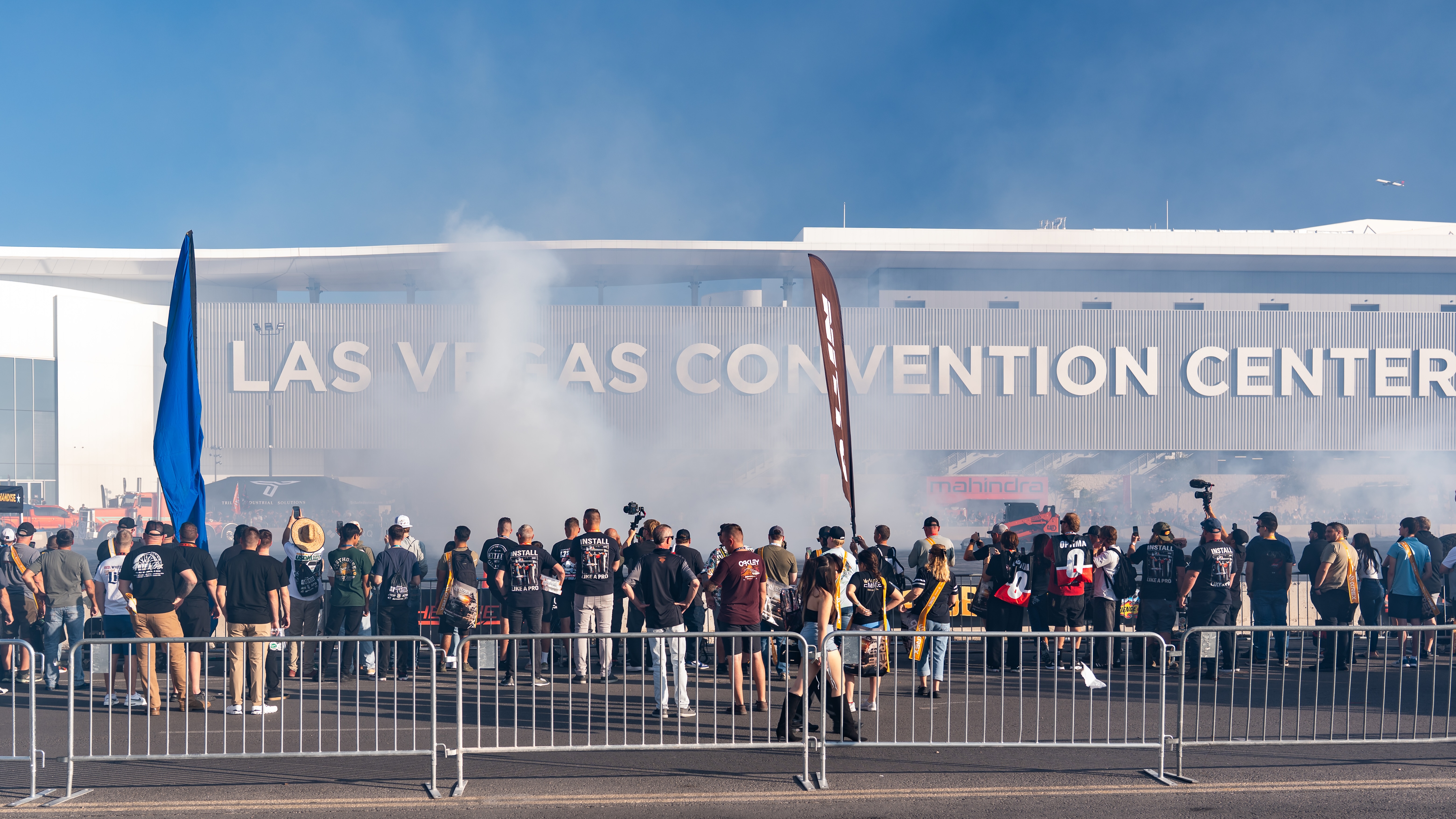 crowd of people watching a car demonstration at SEMA 2025 in Las Vegas