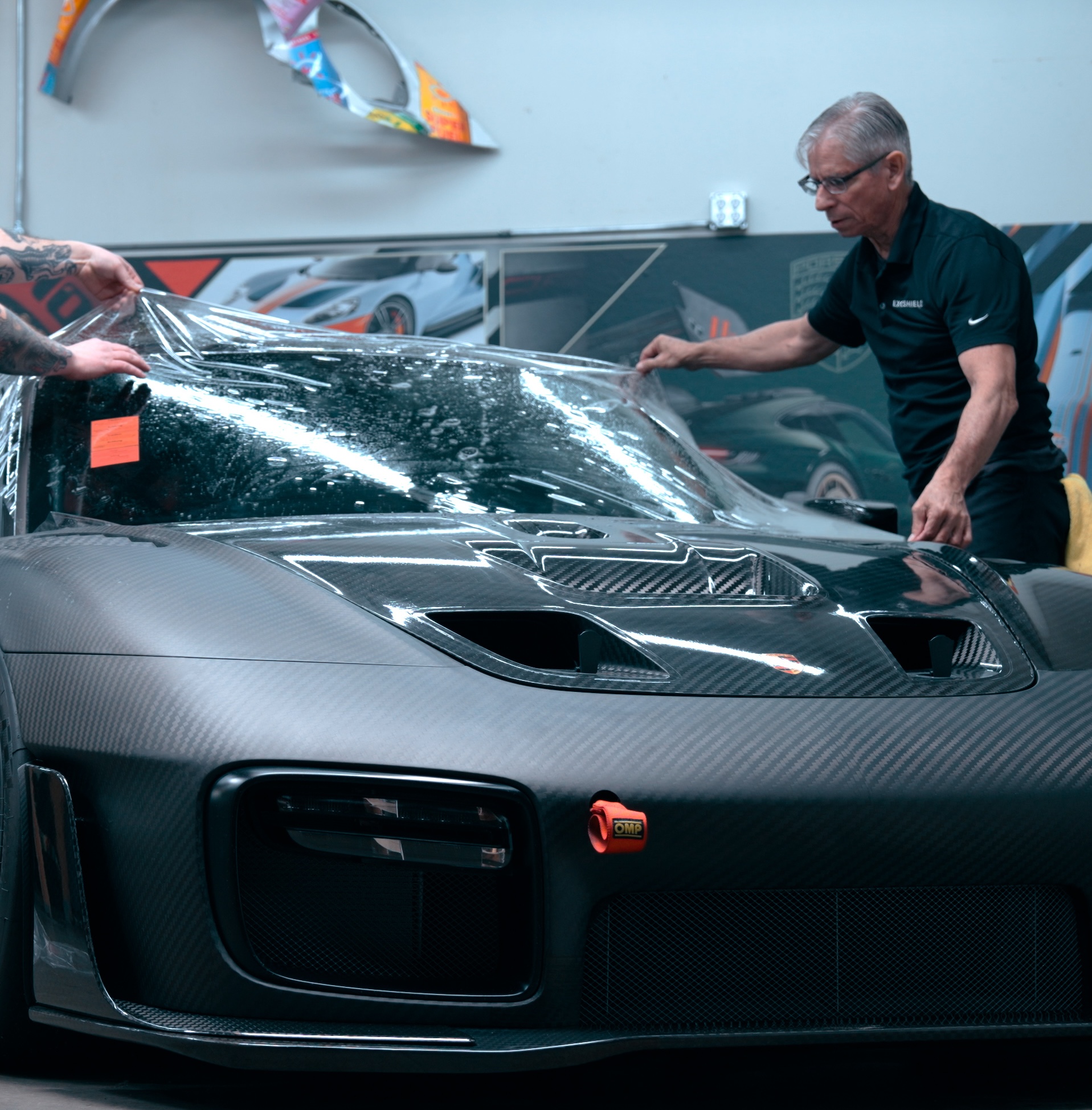 installing windshield protection film on a high-end vehicle