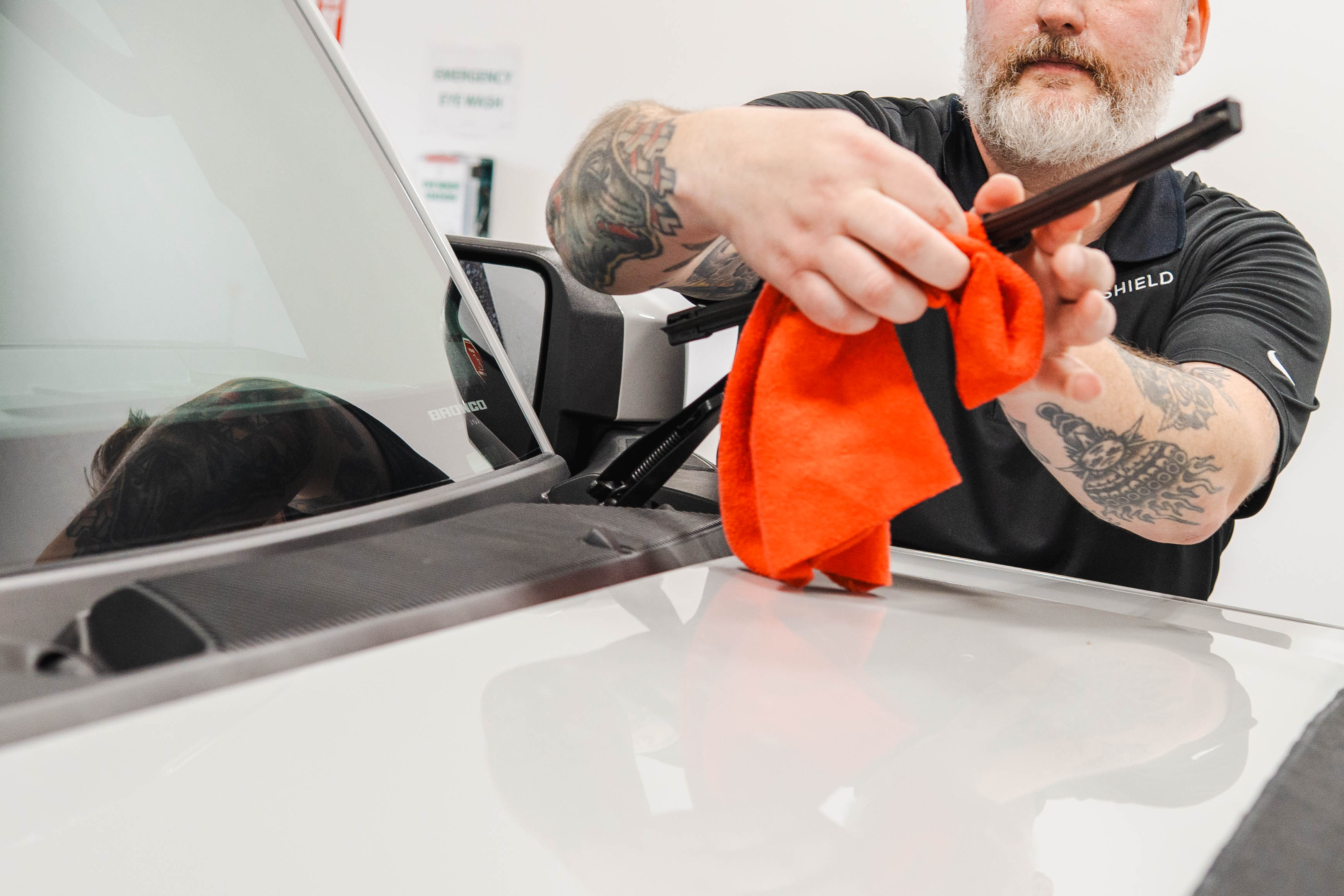 Wiping down the wiper blades so that stuck on debris doesn't scratch or harm the windshield protection film