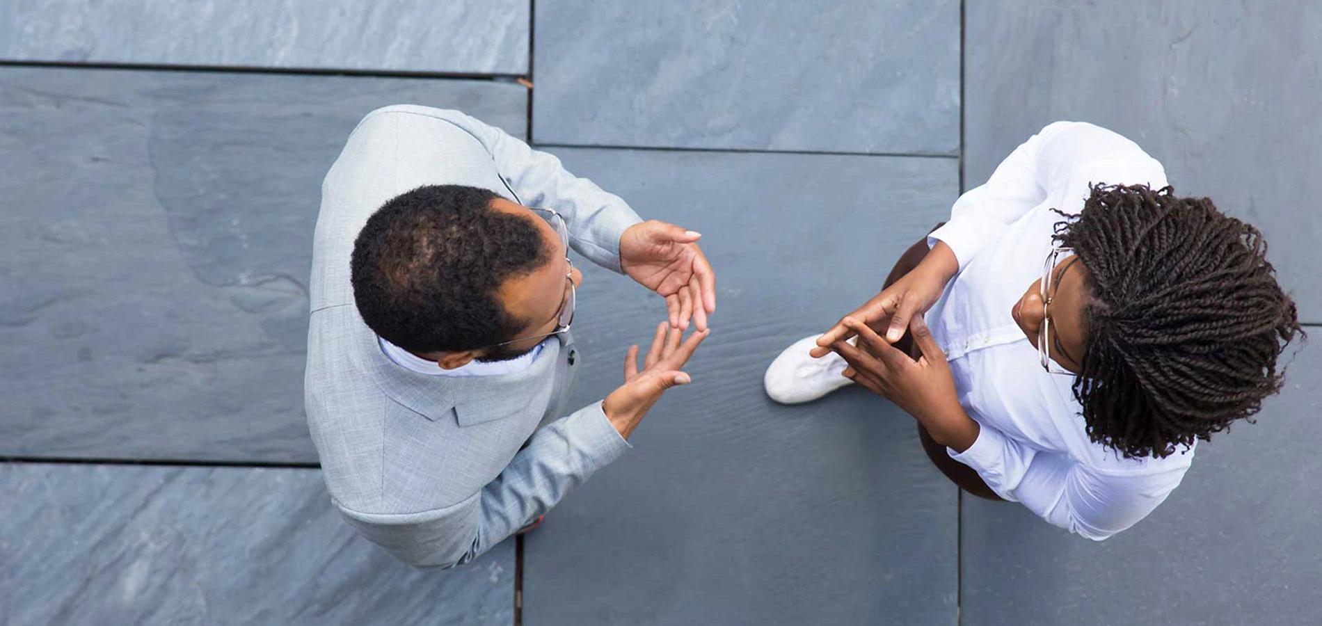 Two people talking in top view