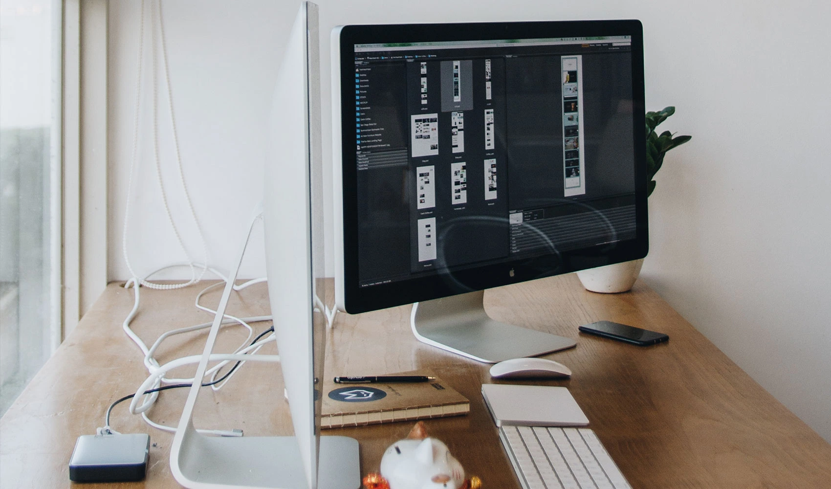 MacIntosh computer in a wooden desk