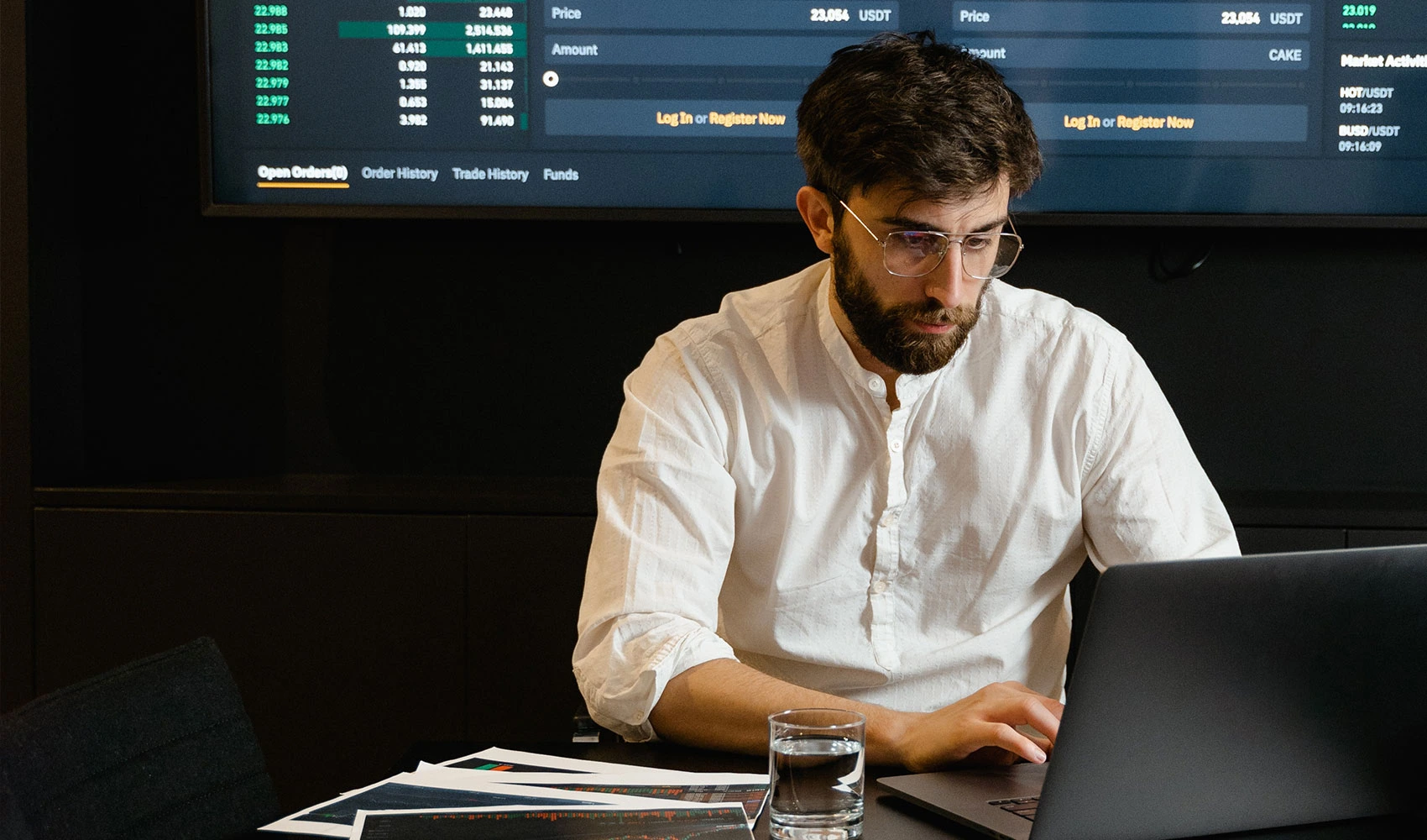Focused professional man using laptop