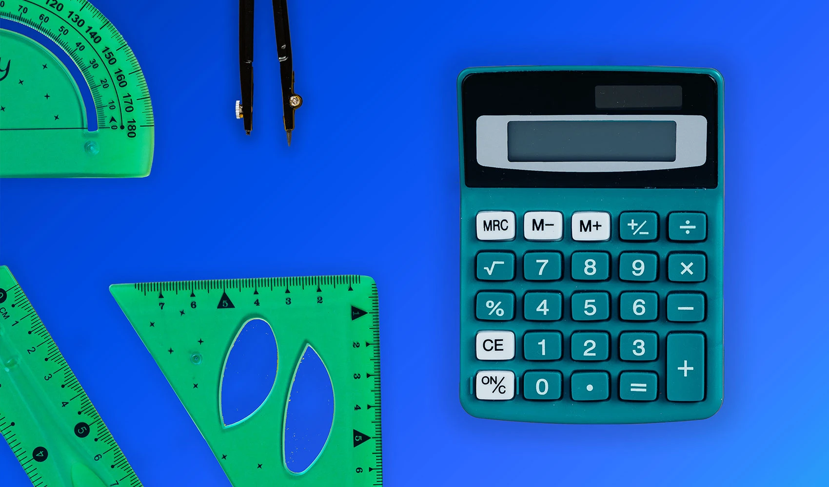 Calculator and protractors on blue background