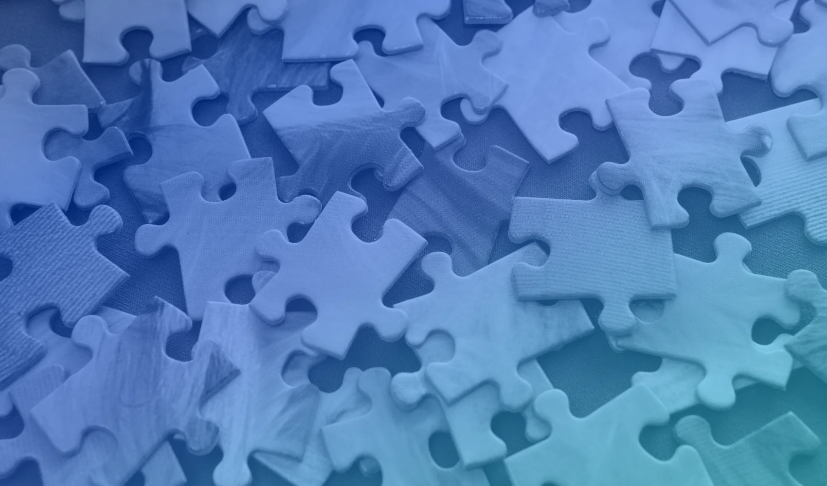 Puzzle pieces with blue gradient overlay