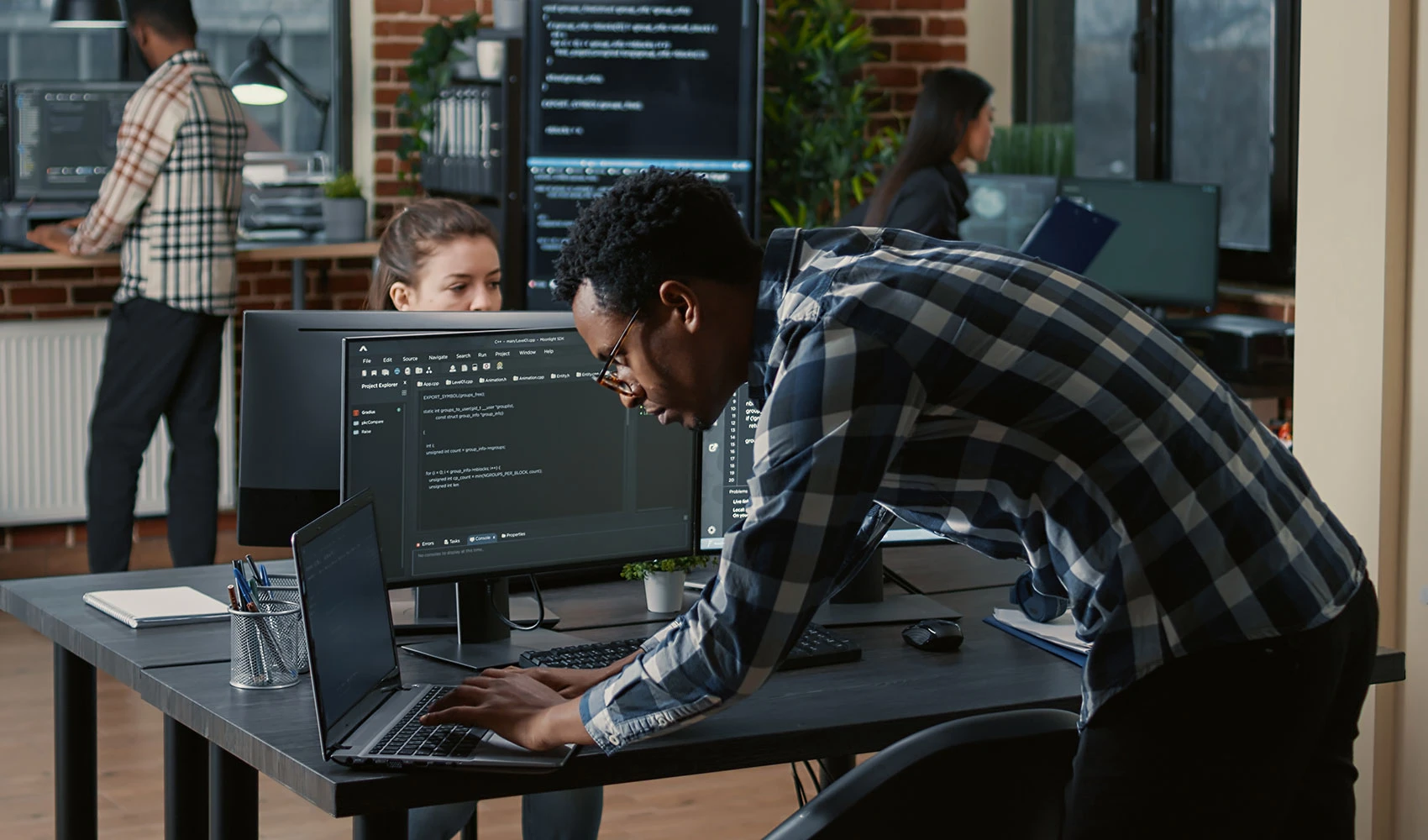 Developer coding on laptop