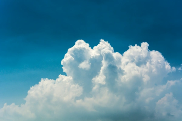 White clouds against a deep blue sky