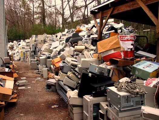 mounds of used computer equipment outside