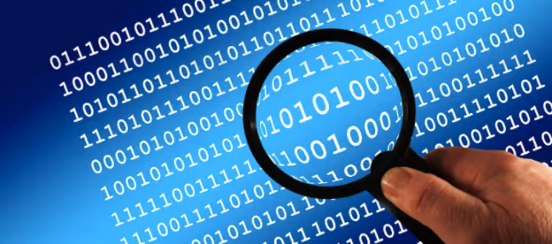 magnifying glass over binary numbers