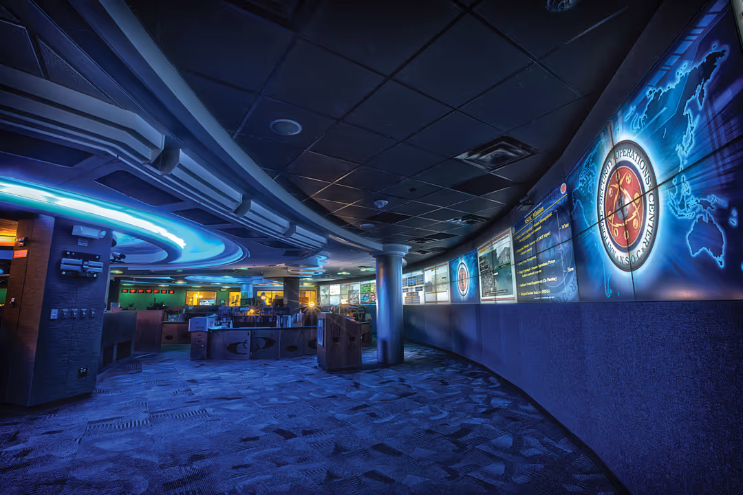 blue lit room with projections on the wall