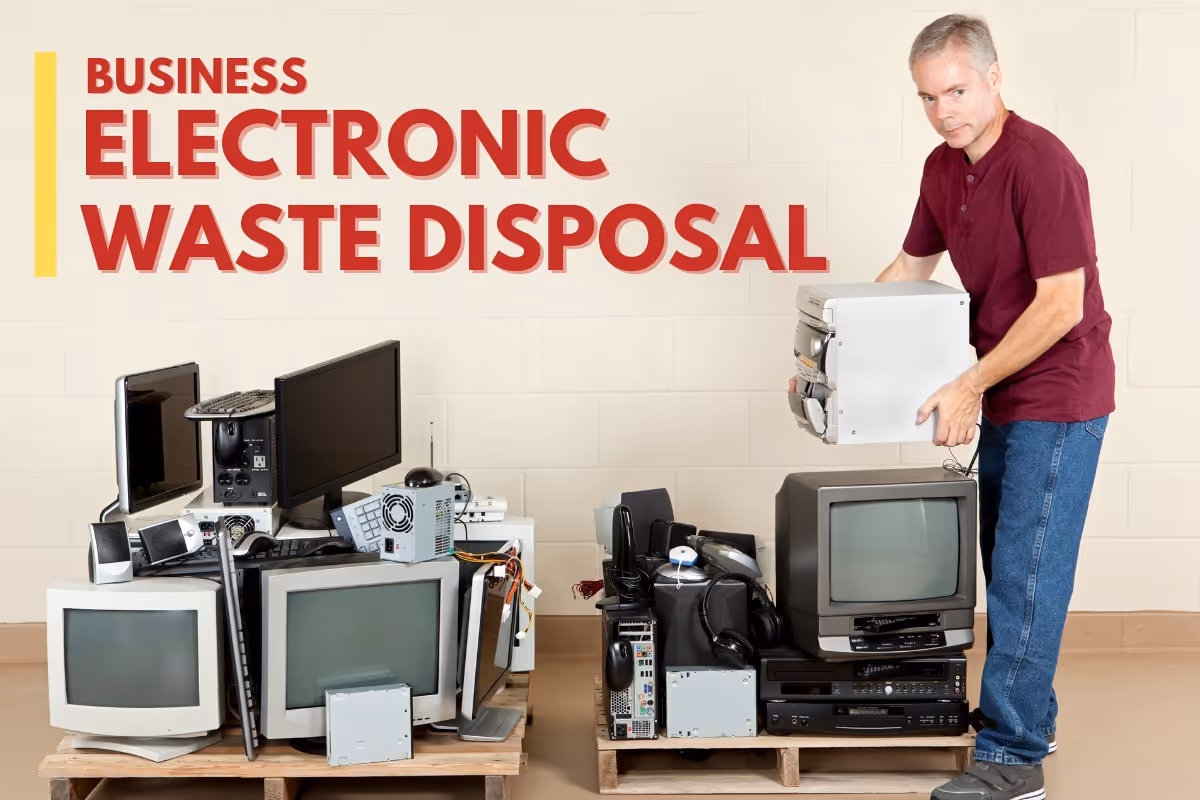 Man stacking unused electronics - Business Electronic Waste Disposal