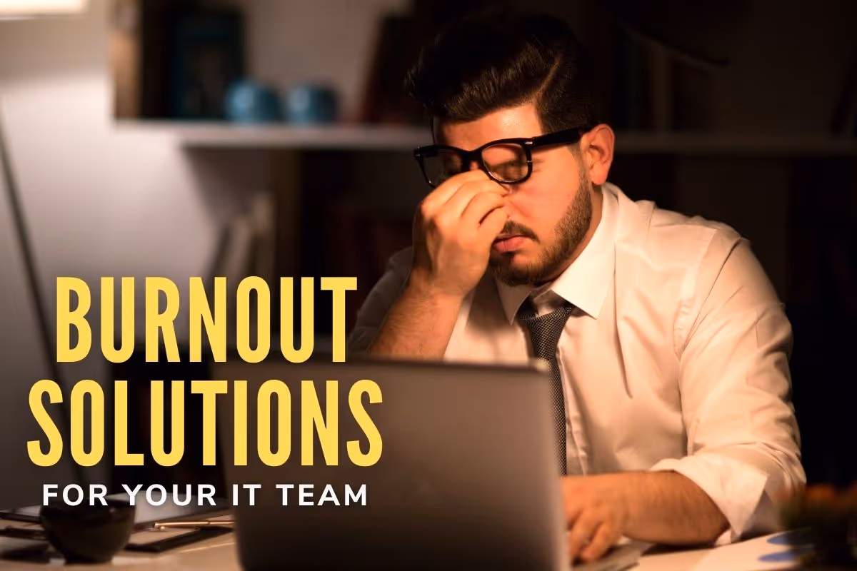 Burnout Solutions for your IT team - Tired man sitting in front of the computer