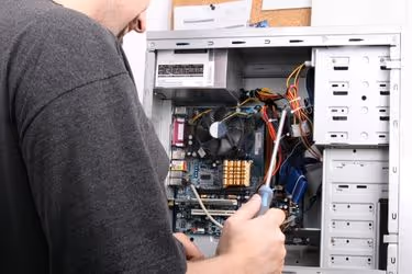 Man repairing a computer