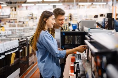 Couple buying a microwave