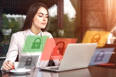Woman working at a cafe with her laptop secured